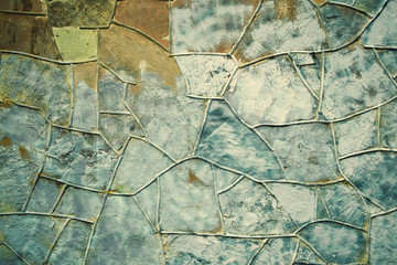 Old stone masonry wall texture background with irregular pattern