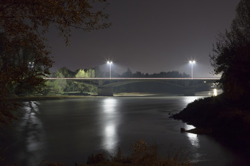 Naklejka na ściany i meble road bridge at night over the river
