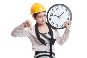 Asian engineer woman thumbs down with a clock.