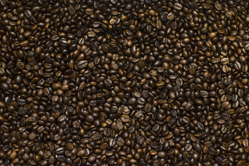 The texture of roasted coffee beans for background , Coffee beans closeup background.