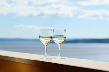 Wineglasses with white wine.