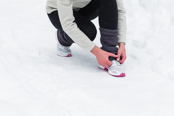 woman running jogging in the winter forest