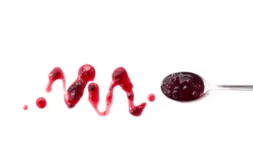 Rolgordijnen Berry jam blot and spoon with jam isolated on white © Ira_Shpiller