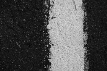 Asphalt with white separation line. White line on the black road texture background. Road markings