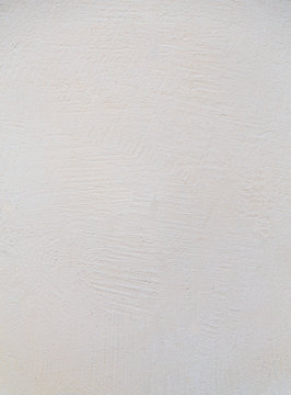 The texture of plaster walls pale yellow rough texture