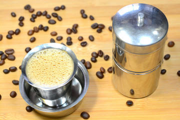 Madras filter coffee with coffee beans and coffee filter. Madras filter coffee is famous filter...