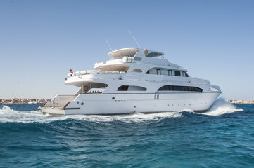 Fototapeta na wymiar Large private motor yacht out at sea
