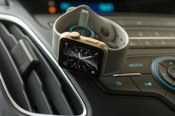 Smart watch on car dashboard