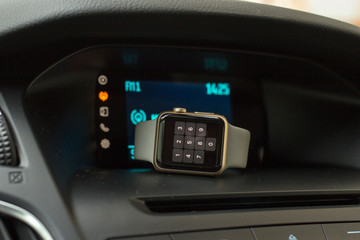 Obraz na płótnie Canvas Smart watch on car dashboard