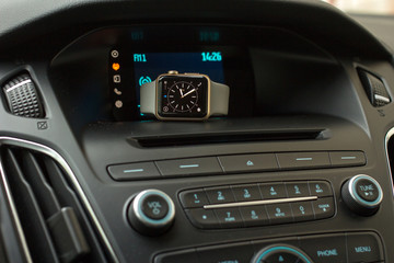 Obraz na płótnie Canvas Smart watch on car dashboard
