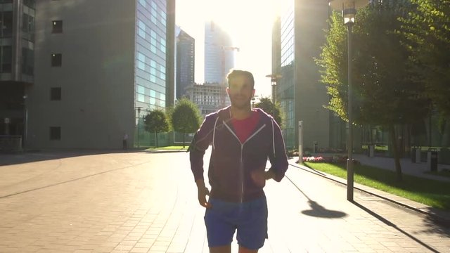 athlete with earphones running in the city, Slow motion, HD movie (1920X1080)