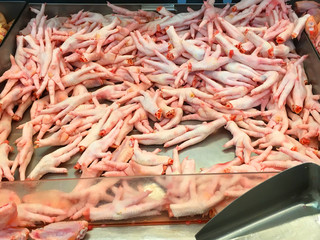 Chickens feet put on the fresh market for sale
