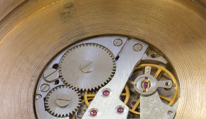Macro cog clockwork mechanism close up micro workings of watch with metallic wheel timepiece precise motion & rotation