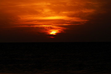 Fototapeta na wymiar Magical very beautiful sunset in cloudy sky, sun ray in the sea of clouds