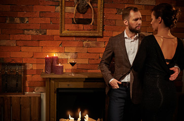 Well-dressed couple in cozy home interior