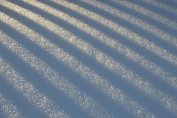 Snow light background with shadow stripes