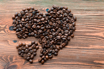 Coffee beans, grain two hearts on background of wooden , bagging. Valentine's Day or Wedding, love, black, frame. Big and small heart
