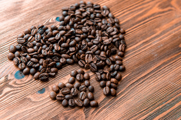 Coffee beans, grain two hearts on background of wooden , bagging. Valentine's Day or Wedding, love, black, frame. Big and small heart