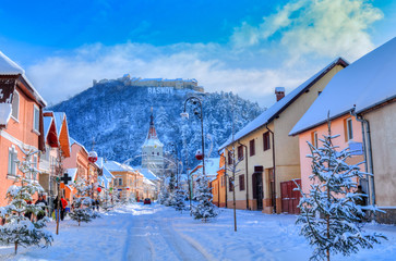 Beautiful winter scene in Rasnov town, medieval city of Transylvania, in Christmas holiday