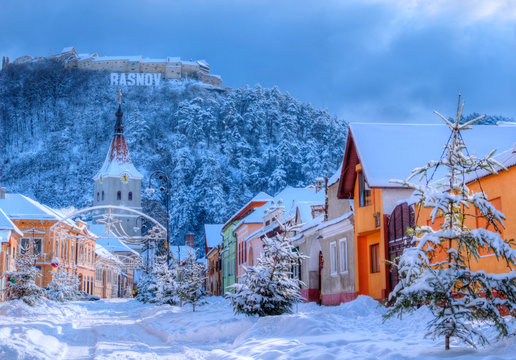 Beautiful winter scene outdoors in Rasnov city, medieval area of Transylvania in Christmas holiday