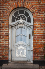 Vintage door in brick building