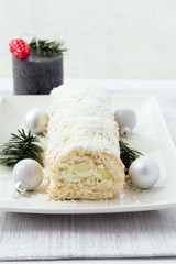 Rolled christmas cake with cocoanut and apples, bûche de noël blanche. 