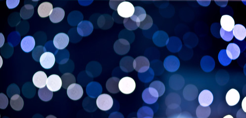 Christmas festive abstract holidays background with bokeh defocused lights and stars