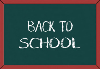 Green school chalkboard with written sentence space