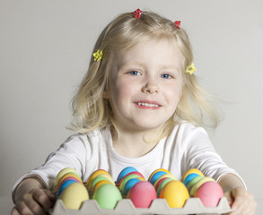 portrait of little girl with Easter eggs
