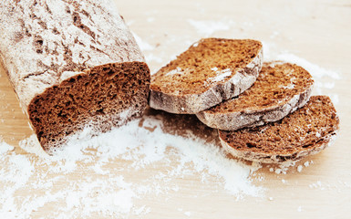 Sliced bread slices on a wooden table