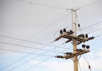 Low-voltage power poles and transmission line junctions with equipment.