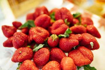 a plate of freshly picked strawberries