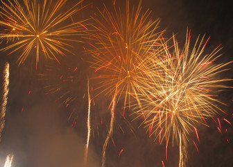 several bright explosions of orange and yellow fireworks