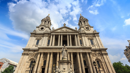 Fototapeta na wymiar London, England - Jul 12, 2014 : People are spending their vacation in the small park at St.Paul Cathedral.