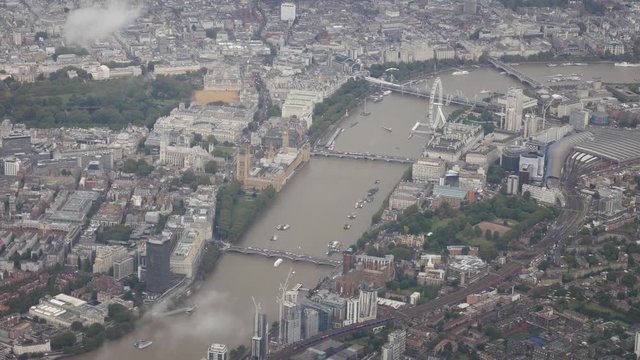 Aerial view from a flying plane in the sky over London city center