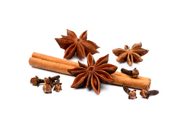 Aromatic star anise, cloves and cinnamon isolated on white background