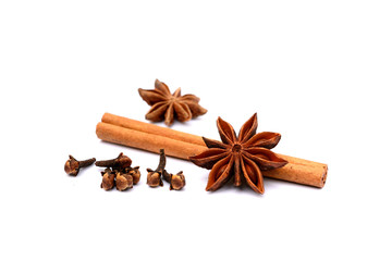 Aromatic star anise, cloves and cinnamon isolated on white background