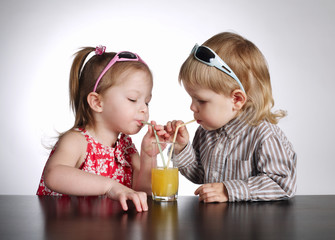 boy and girl drinking juice