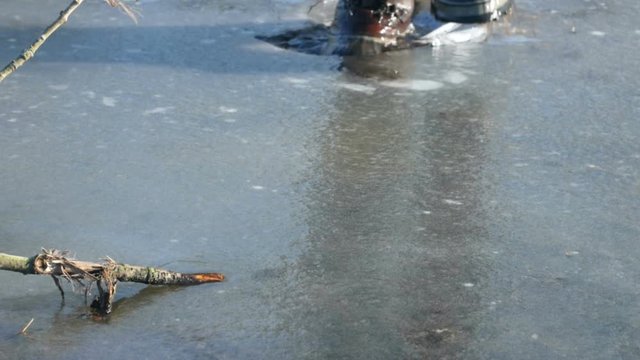 Boots crushing through ice.