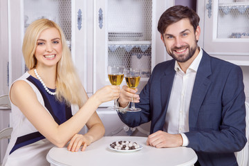 Beautiful Young couple having fun together in valentine days. drinking white wine and enjoying their good romantic dating.