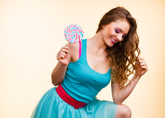 Woman joyful girl with lollipop candy