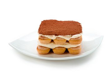Tiramisu on white plate isolated. Clipping path.