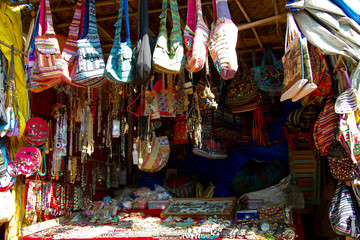 Local vendor's stall with bags and accessories for women tourists at the Anjuna beach in north Goa, India