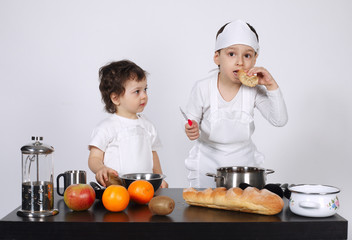 brothers making cake in the kitchen