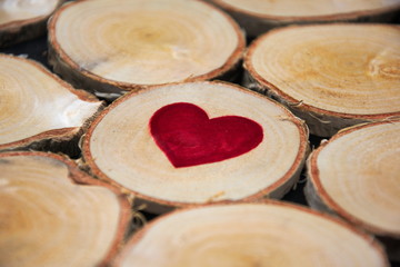 Red heart on a piece of wood