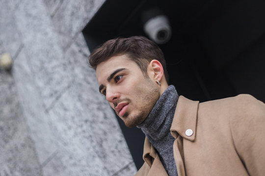 Beautiful young man posing in an urban context