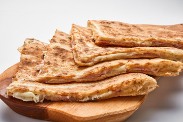 Toasted sandwich with cheese and ham..