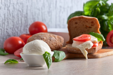Sandwich with mozzarella, tomato and basil