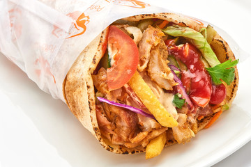shawarma with sauce on white background..