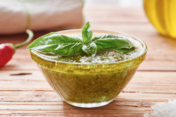 Fresh pesto sauce in glass bowl